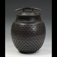 Larry Richmond: Stoneware coverd jar leather laced