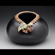 Leslee Burtt: HW08 Black necklace cut with rhyolite leaves