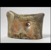Brendan Fuller: pillow with hole.  unglazed wood fired Danish porcelain.